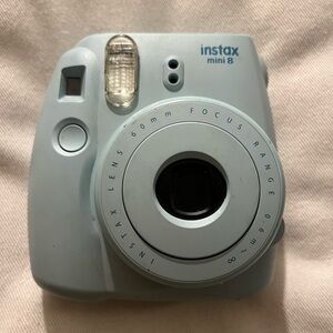 Polaroid camera: Fujifilm, Instax Mini 8. Light blue color, lightly used